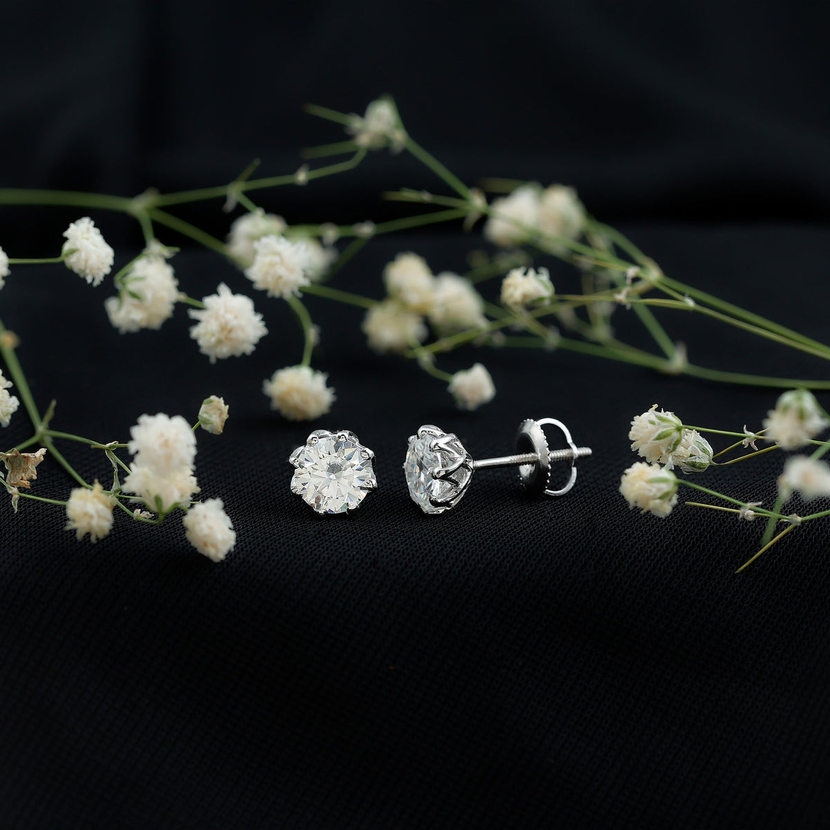 Certified brilliant cut 1.9 carat Moissanite solitaire stud earrings by Rosec Jewels, showcasing sparkling, elegant earrings with a classic design.