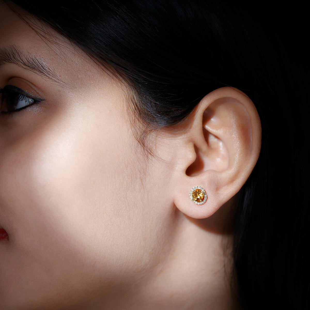 Round citrine and diamond stud earrings by Rosec Jewels featuring gold setting and sparkling gemstone accents.