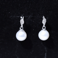 Elegant freshwater pearl and diamond drop earrings by Rosec Jewels featuring 14.9 carats of genuine pearls and sparkling diamonds.