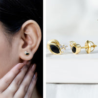Marquise shape 0.7 carat lab-grown black and white diamond stud earrings by Rosec Jewels on a white background.