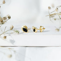 Marquise shape 0.7 carat lab-grown black and white diamond stud earrings by Rosec Jewels displayed on a white background.
