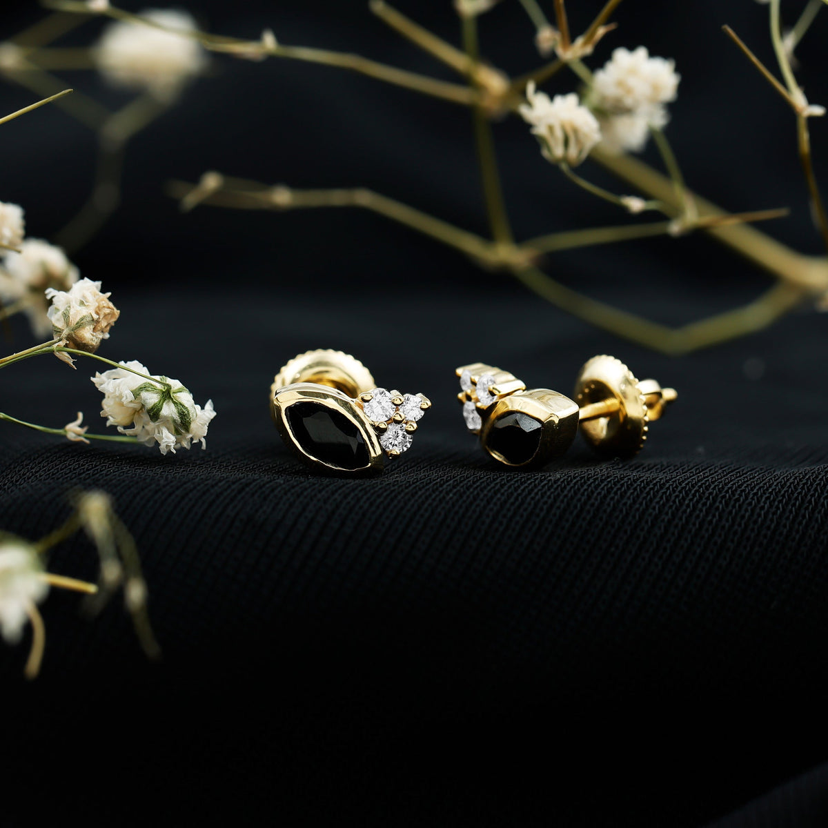 Marquise shape 0.7 carat lab-grown black and white diamond stud earrings by Rosec Jewels on a white background