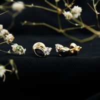 Marquise shape 0.7 carat lab-grown black and white diamond stud earrings by Rosec Jewels on a white background