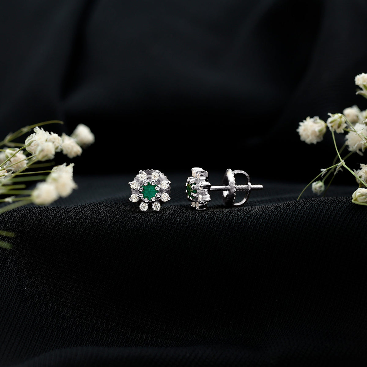 Natural emerald and diamond floral stud earrings from Rosec Jewels featuring vibrant green emeralds and sparkling diamonds.