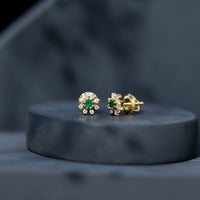 Natural emerald and diamond floral stud earrings from Rosec Jewels featuring vibrant green gemstones and sparkling accents.