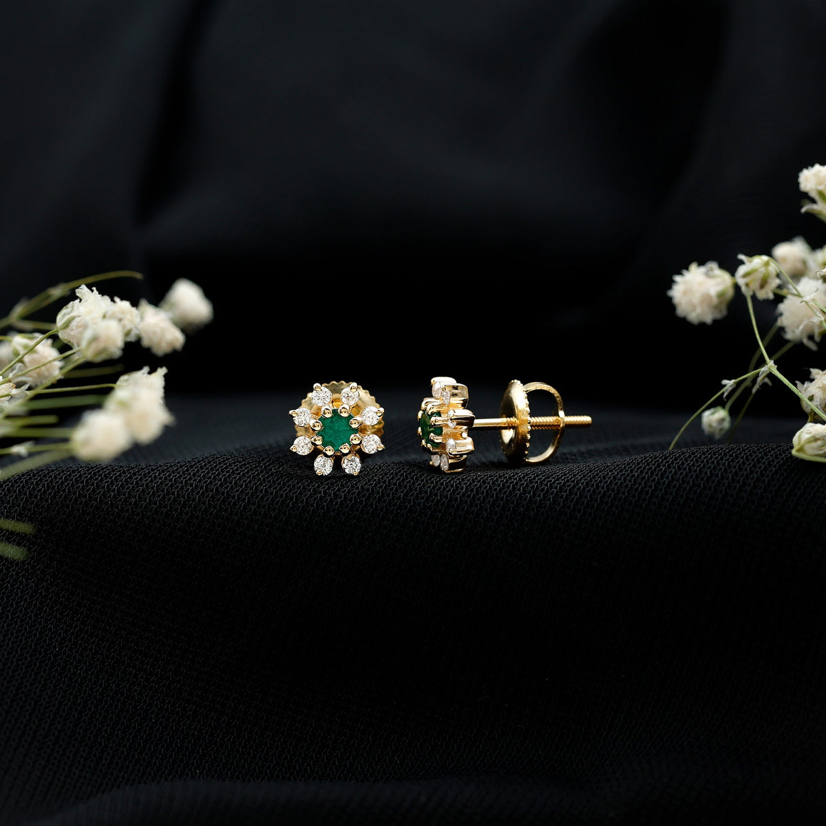 Natural emerald and diamond floral stud earrings by Rosec Jewels featuring vibrant green emeralds and sparkling diamonds.