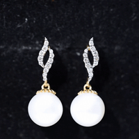 Freshwater pearl drop earrings with diamond accents by Rosec Jewels, showcasing elegant white pearls and sparkling gemstones.