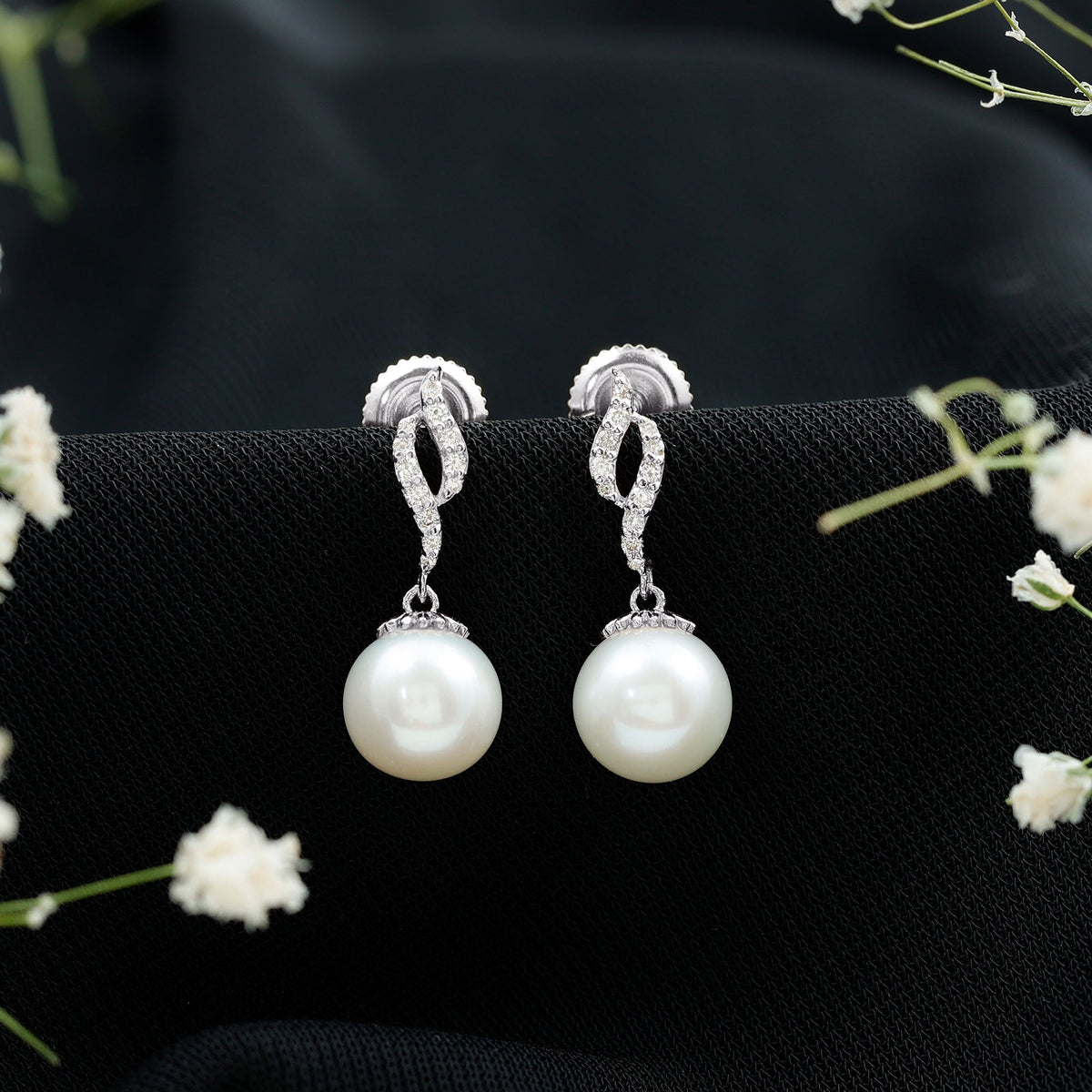 Freshwater pearl drop earrings with diamond accents by Rosec Jewels, showcasing elegant pearl and sparkling diamond details.