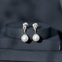 Freshwater pearl drop earrings with diamond accents by Rosec Jewels, featuring 14.9 carats of elegant pearls and sparkling detailing.