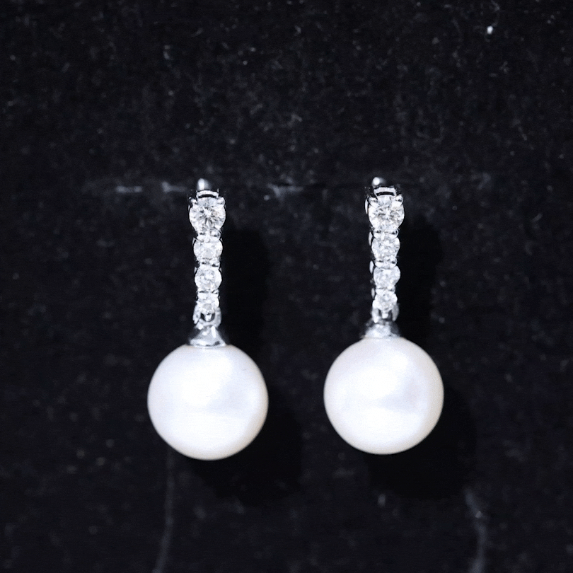 Yellow gold freshwater pearl drop earrings with diamond accents from Rosec Jewels, showcasing elegant jewelry design.