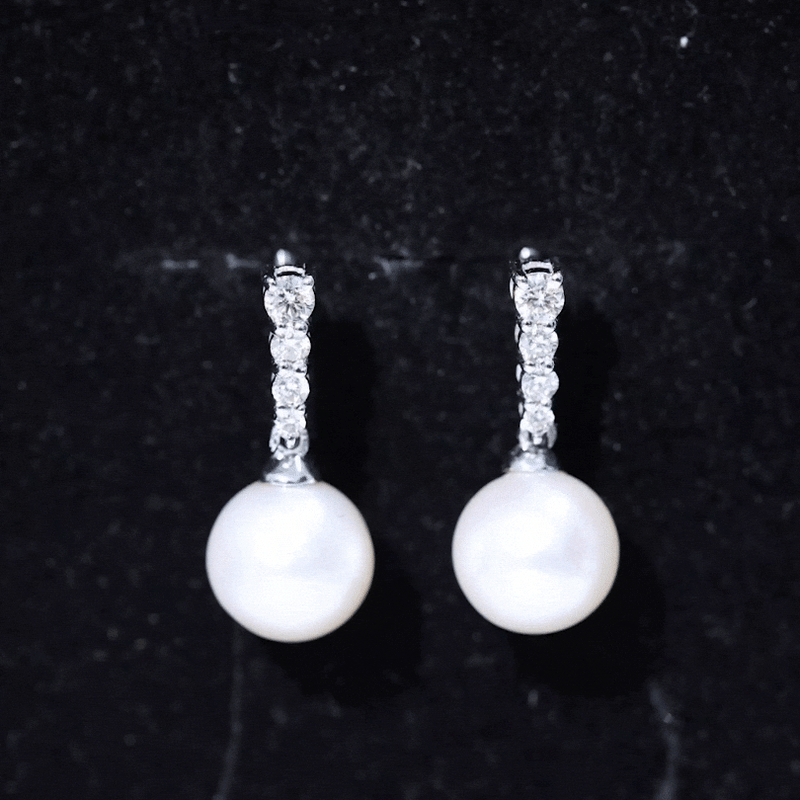 Yellow gold freshwater pearl drop earrings with diamond accents from Rosec Jewels, showcasing elegant jewelry design.