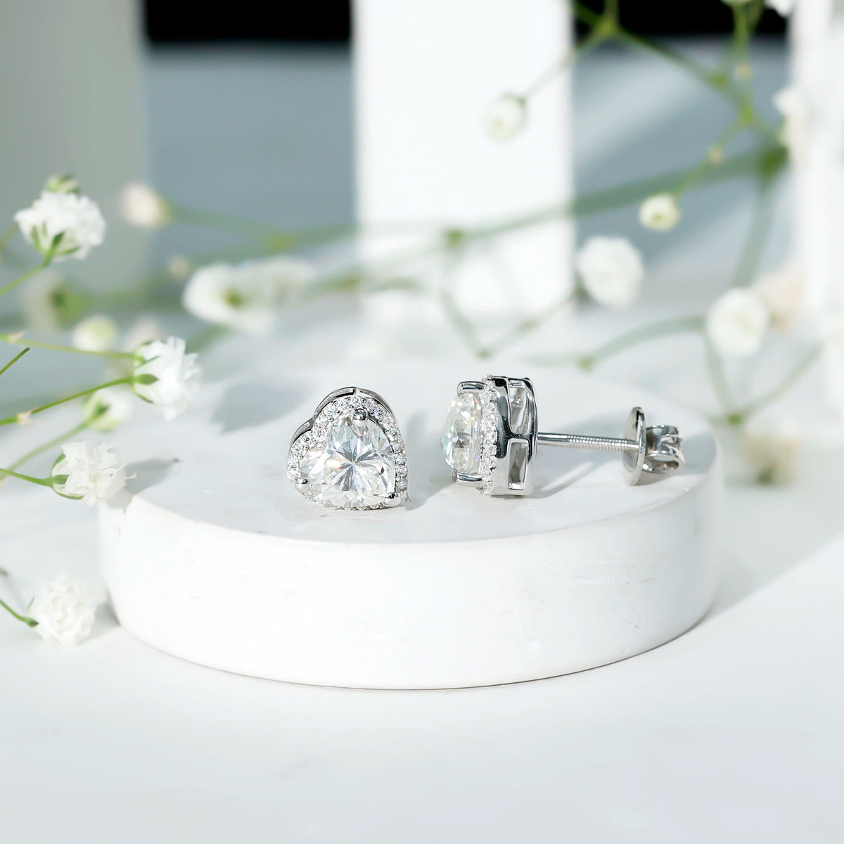 Rosec Jewels 3 Carat Heart Moissanite Halo Stud Earrings with sparkling halo and classic stud design.
