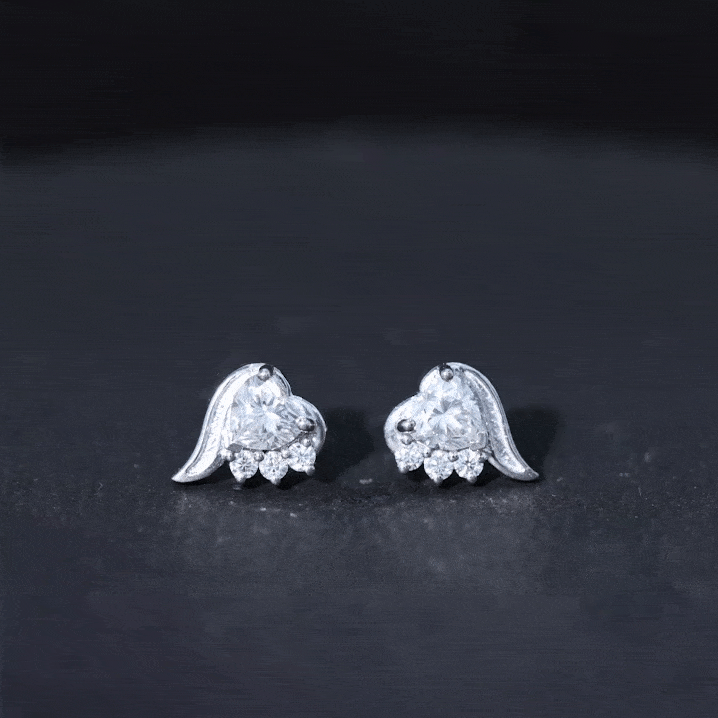Sterling silver heart-shaped moissanite stud earrings with 1 carat total weight from Rosec Jewels, featuring sparkling white stones.