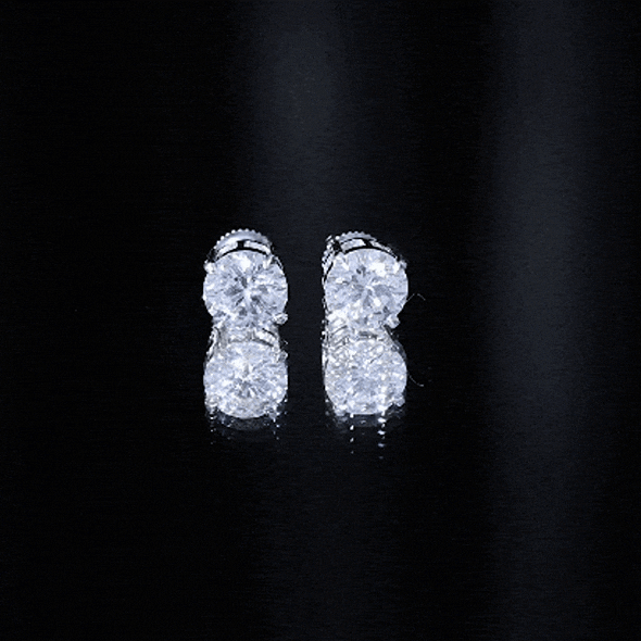Silver 4 Carat Round Cubic Zirconia Stud Earrings by Rosec Jewels, showcasing sparkling gemstone studs on sleek silver settings.