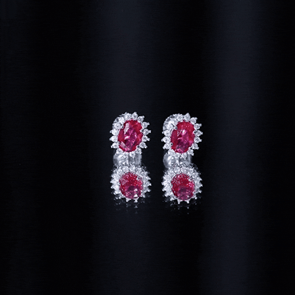 Rosec Jewels 2 Carat oval cut lab-grown ruby stud earrings with moissanite halo, featuring sparkling gemstone accents.