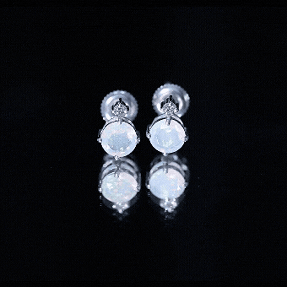 Ethiopian Opal diamond solitaire stud earrings by Rosec Jewels featuring yellow opals and sparkling diamonds on a silver setting.