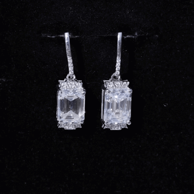 Elegant 3.5 carat emerald cut moissanite drop earrings for women by Rosec Jewels, featuring sparkling white stones and a sophisticated design.