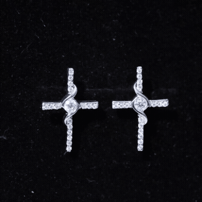 Sterling silver moissanite cross stud earrings with sparkling white stones, designed by Rosec Jewels.