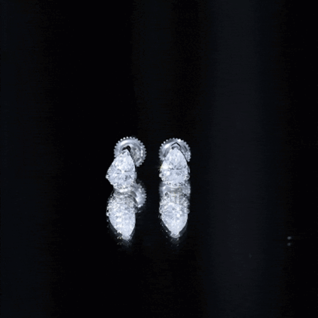 Pear-shaped 1.5 carat Moissanite stud earrings by Rosec Jewels, featuring sparkling white gemstones on a classic metal setting.