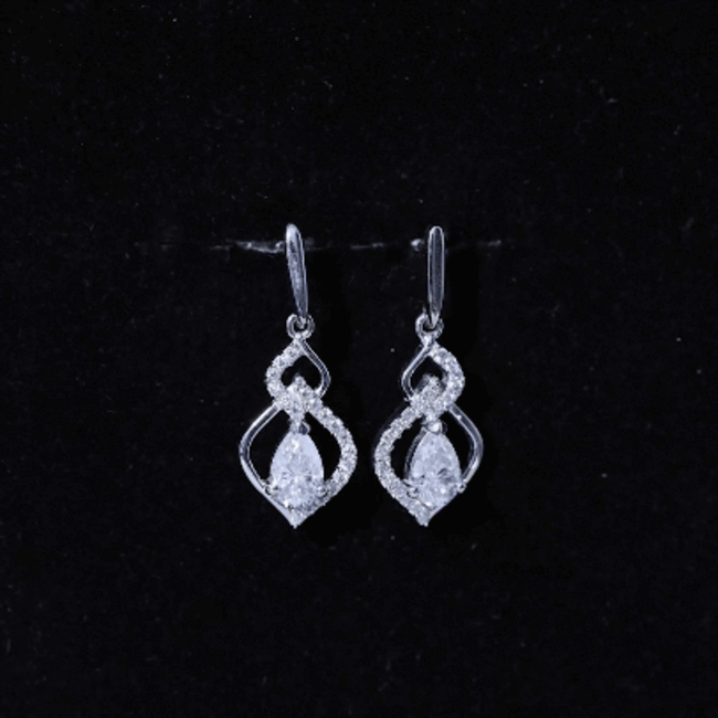 Pear-shaped moissanite dangle earrings from Rosec Jewels, featuring a 1-carat certification, ideal for wedding jewelry.