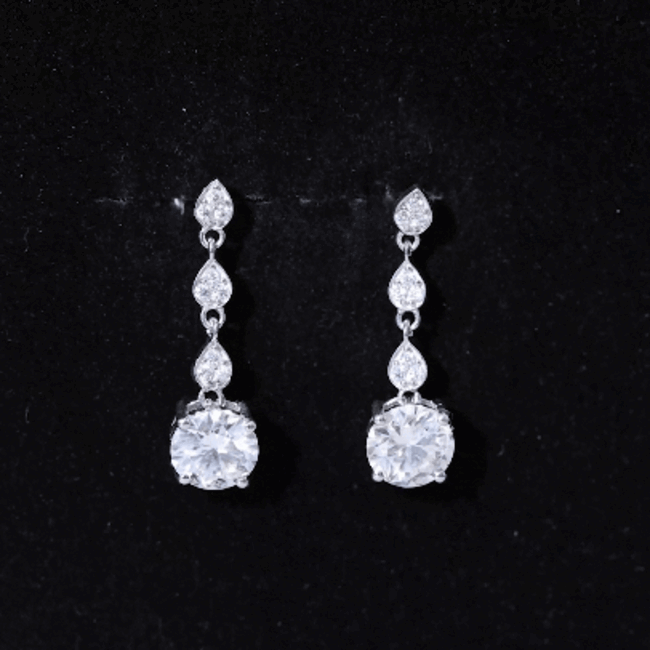 Certified 2.7 carat Moissanite dangling earrings in silver with rose gold accents, featuring sparkling gemstone drops.
