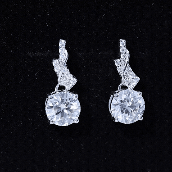 Silver drop earrings with 4.2 CT certified Moissanite stones, designed by Rosec Jewels, featuring a elegant dangling style.