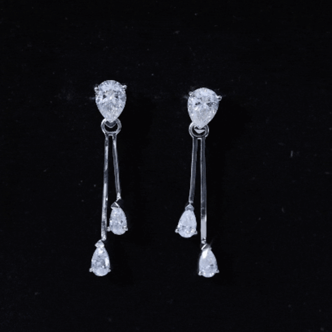 Sterling silver moissanite bar dangle earrings with sparkling white stones, designed by Rosec Jewels.