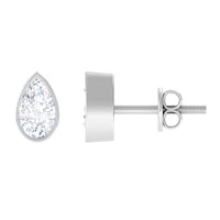 Rosec Jewels bezel set diamond tiny stud earrings, close-up of sparkling diamond accents on small gold earrings.