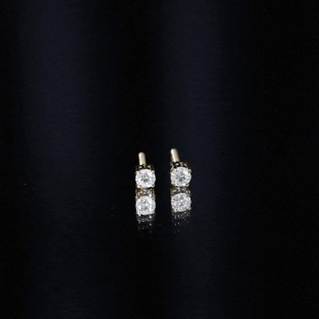 Brilliant cut diamond stud earrings in prong setting by Rosec Jewels, showcasing sparkling white diamonds on a sleek earring design.