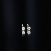 Yellow brilliant cut diamond stud earrings in prong setting by Rosec Jewels, showcasing sparkling gemstones on a classic earring design.