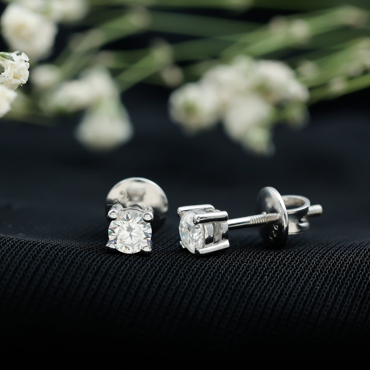 Brilliant cut diamond stud earrings in prong setting by Rosec Jewels showcasing sparkling diamonds on a white background.