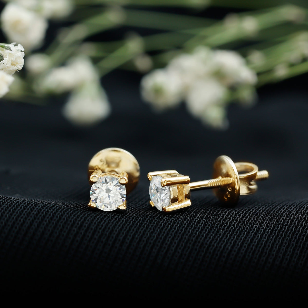 Brilliant cut diamond stud earrings in prong setting by Rosec Jewels, showcasing sparkling diamonds on a sleek metal post.