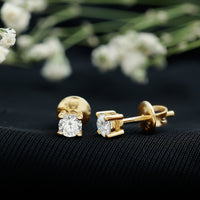 Brilliant cut diamond stud earrings in prong setting by Rosec Jewels, showcasing sparkling diamonds on a sleek metal post.