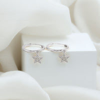 Rosec Jewels Diamond Star Drop Hoop Earrings featuring sparkling diamond star charms on gold hoops.