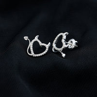 Round diamond devil heart earrings by Rosec Jewels featuring sparkling diamonds in a unique devil heart design.