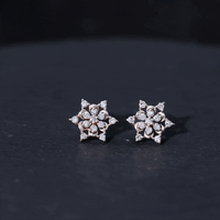 Rosec Jewels certified diamond snowflake stud earrings featuring yellow gold setting, showcasing intricate snowflake design.