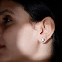 Cultured pearl stud earrings with diamond accents by Rosec Jewels, showcasing elegant jewelry design on a white background.