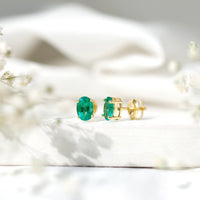 Oval shape emerald stud earrings for women featuring 1.43 carats, crafted by Rosec Jewels with elegant gemstone detail.
