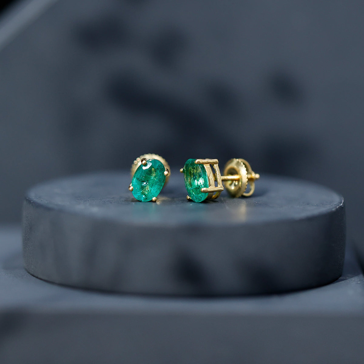 Oval shape emerald stud earrings for women, 1.43 carats, by Rosec Jewels, featuring vibrant green gemstones and classic design.