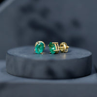 Oval shape emerald stud earrings for women, 1.43 carats, by Rosec Jewels, featuring vibrant green gemstones and classic design.