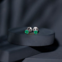 Round cut 5mm real emerald stud earrings by Rosec Jewels featuring sparkling green gemstones and classic silver settings.
