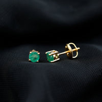 Round cut 5mm real emerald stud earrings by Rosec Jewels featuring vibrant green gemstones and classic earring posts.