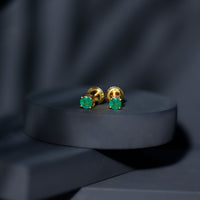 Round cut 5mm real emerald stud earrings by Rosec Jewels featuring vibrant green gemstones set in classic earrings.