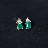 Genuine 1.32 carat emerald cut emerald stud earrings with diamond cluster from Rosec Jewels, showcasing elegant gemstone designs.