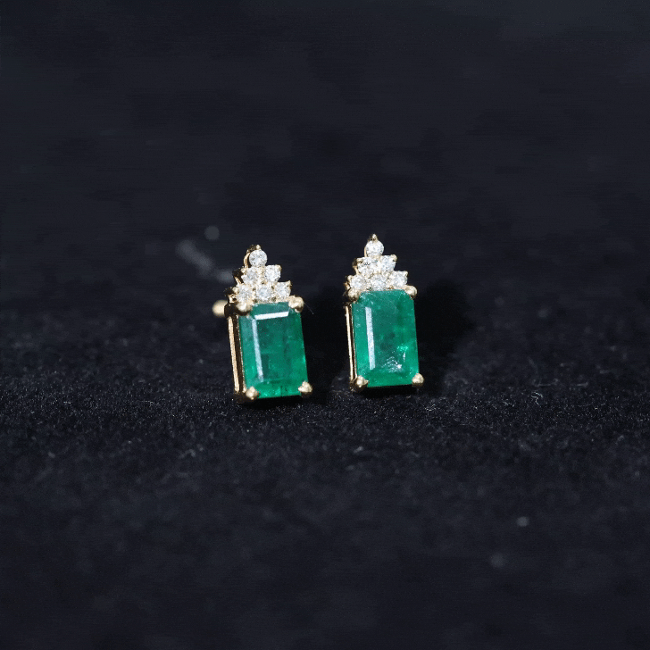 Genuine 1.32 carat emerald cut emerald stud earrings with diamond cluster setting by Rosec Jewels