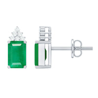Genuine 1.32 Carat emerald cut emerald stud earrings with diamond cluster by Rosec Jewels, featuring sparkling green gemstones and diamond accents.