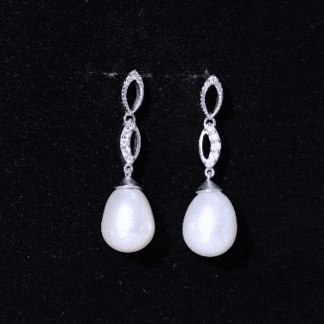 Genuine freshwater pearl and diamond infinity drop earrings by Rosec Jewels, featuring elegant yellow accents and delicate design.