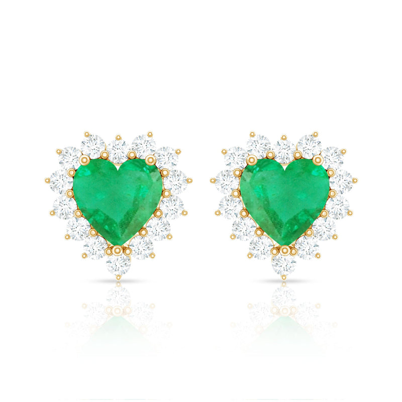 Natural emerald heart stud earrings with diamond halo from Rosec Jewels, featuring vibrant green emeralds and sparkling diamonds.