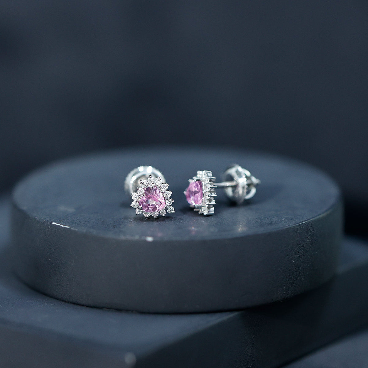 Lab-grown 0.6 carat pink sapphire heart stud earrings with diamond halo, featuring Rosec Jewels' elegant jewelry design.
