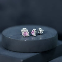 Lab-grown 0.6 carat pink sapphire heart stud earrings with diamond halo, featuring Rosec Jewels' elegant jewelry design.